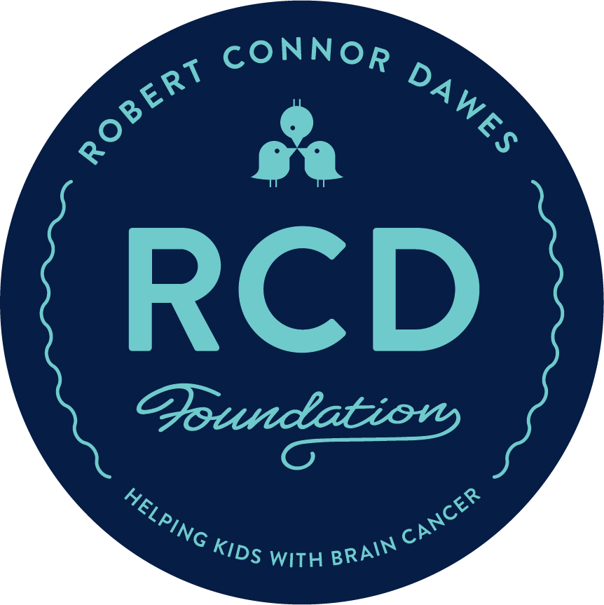 Circular blue logo for the Robert Connor Dawes Foundation with three bird icons above RCD Foundation. Text around the edge reads Helping kids with brain cancer.